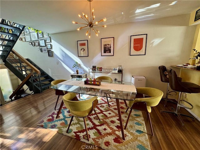 dining room featuring dark hardwood / wood-style floors and a notable chandelier