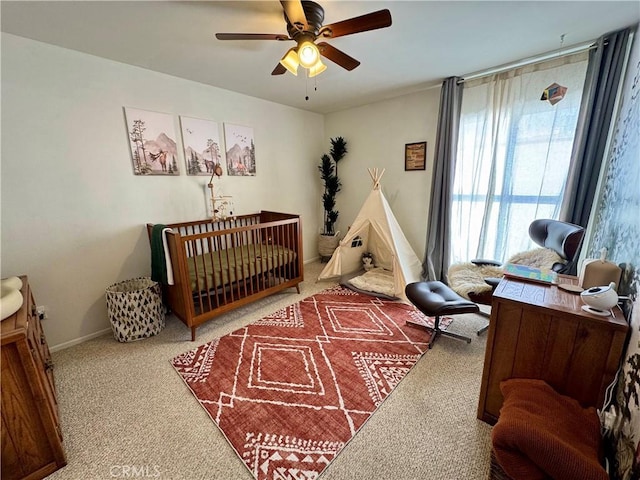 bedroom featuring ceiling fan and carpet flooring