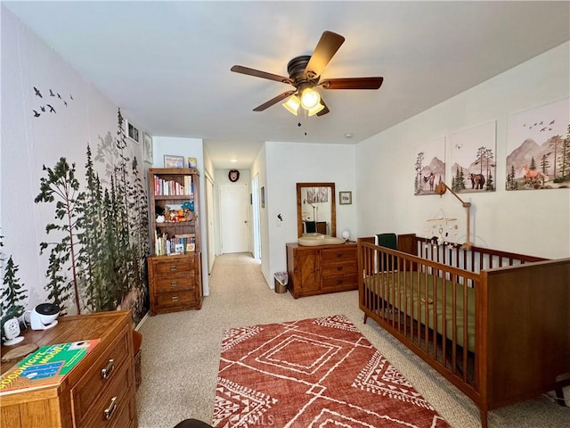 carpeted bedroom with ceiling fan