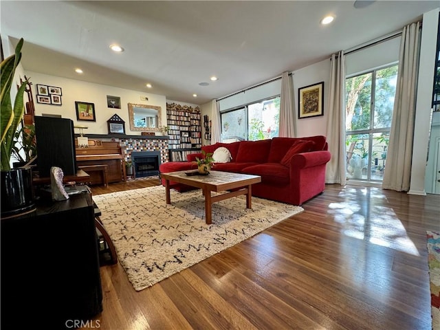 living room featuring hardwood / wood-style flooring and a fireplace