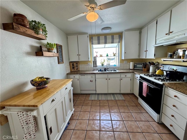 kitchen featuring white cabinetry, sink, white dishwasher, and gas stove