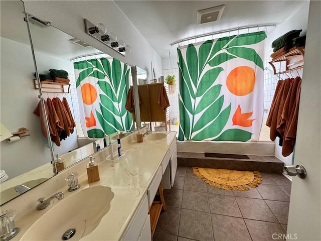 bathroom featuring tile patterned floors, shower / bathtub combination with curtain, and vanity