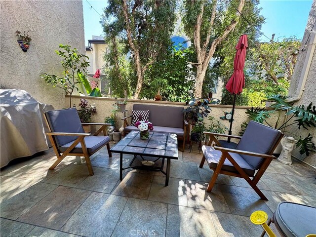 balcony featuring a grill and outdoor lounge area