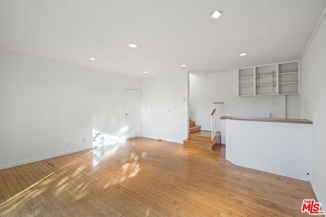 unfurnished living room featuring light hardwood / wood-style floors