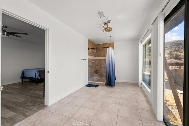 interior space featuring ceiling fan