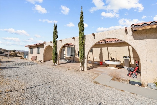 rear view of property with a patio area