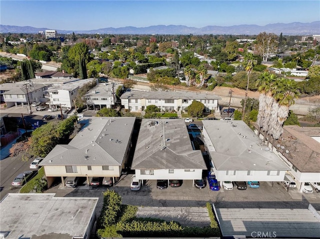 birds eye view of property featuring a mountain view