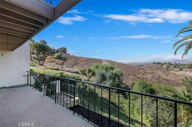 balcony featuring a mountain view