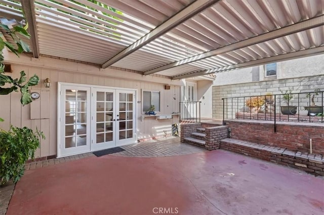 view of patio with a pergola and french doors