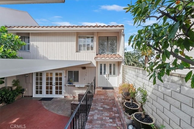 rear view of house featuring french doors and a patio