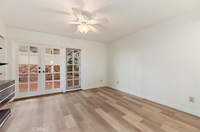 unfurnished room featuring french doors, ceiling fan, and light hardwood / wood-style flooring