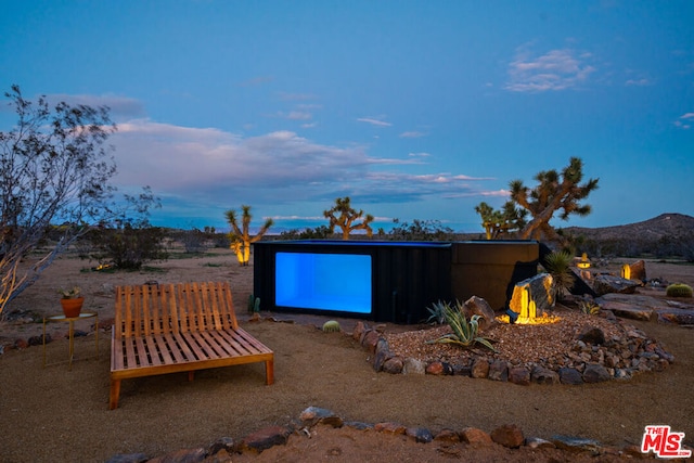 yard at dusk with a mountain view