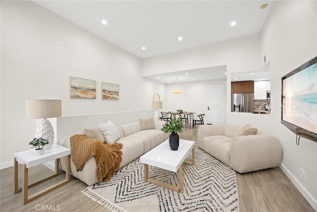 living room with light hardwood / wood-style floors