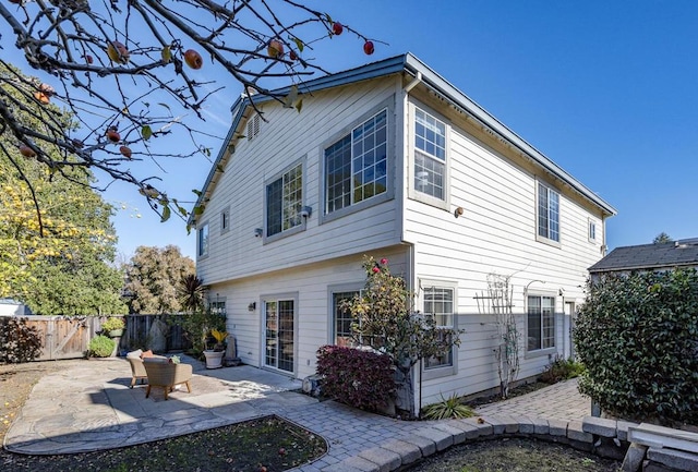 rear view of property featuring a patio