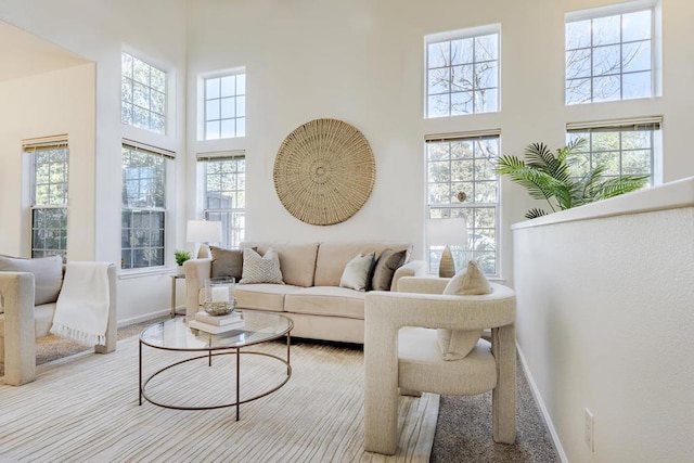 living room with a towering ceiling