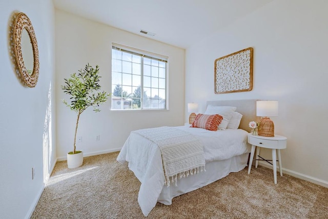 bedroom featuring light colored carpet