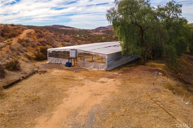 exterior space featuring a mountain view