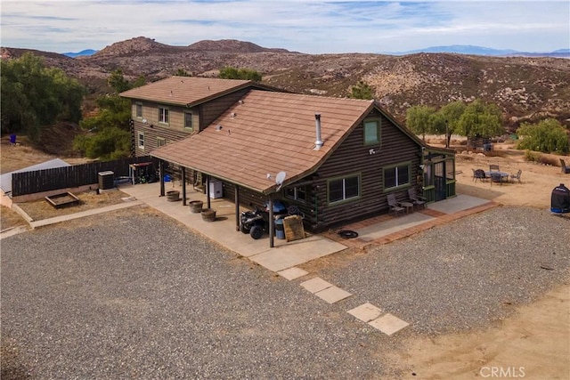 birds eye view of property with a mountain view