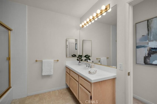 bathroom featuring vanity, tile patterned floors, and combined bath / shower with glass door