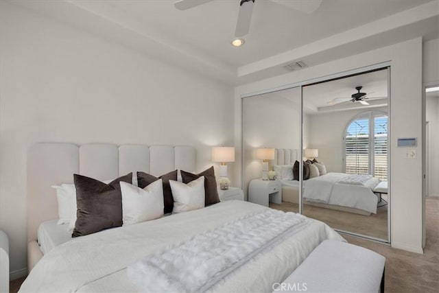 bedroom featuring ceiling fan, carpet floors, and a closet