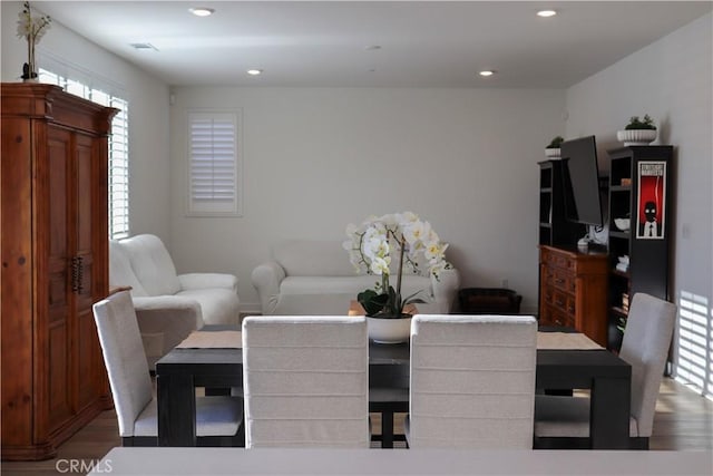 dining room with hardwood / wood-style flooring