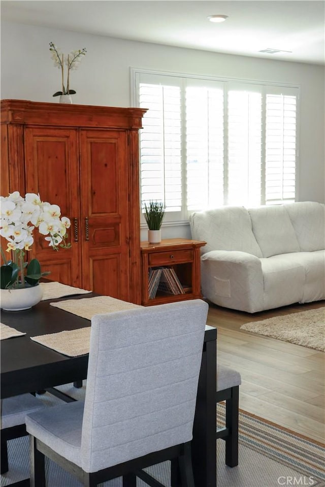 dining room with light hardwood / wood-style floors