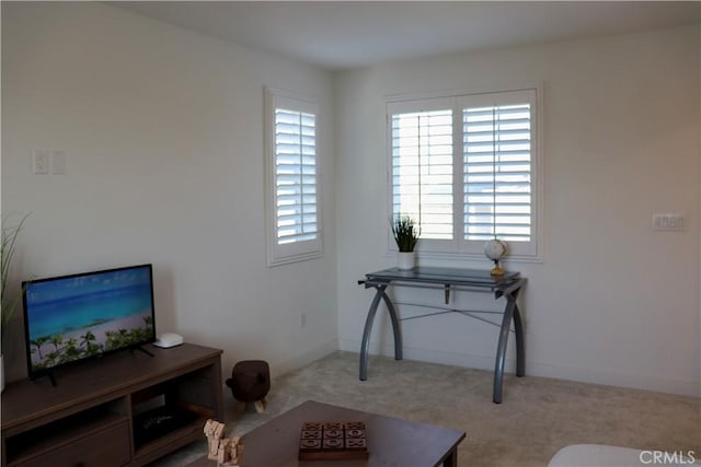 living area with light colored carpet