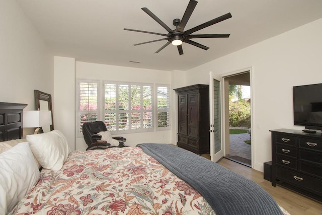 bedroom with ceiling fan, access to exterior, and light wood-type flooring