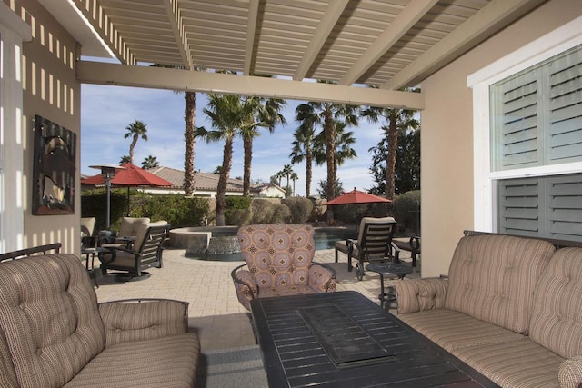 view of patio / terrace with a swimming pool with hot tub and an outdoor hangout area