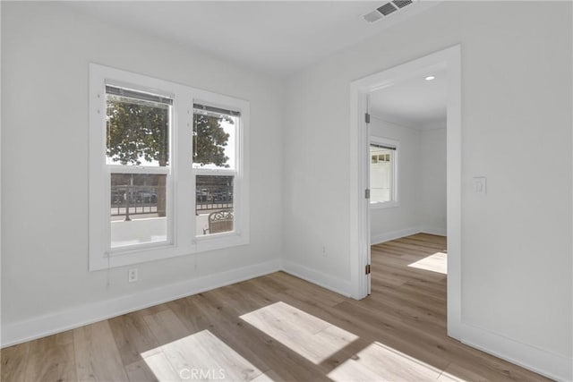 unfurnished room featuring light hardwood / wood-style flooring