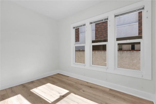 spare room with light wood-type flooring