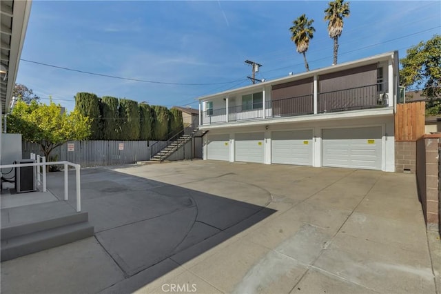 exterior space with a balcony and a garage