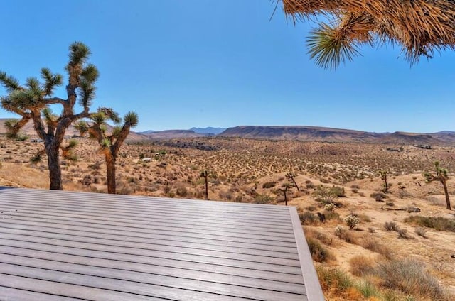 wooden terrace with a mountain view