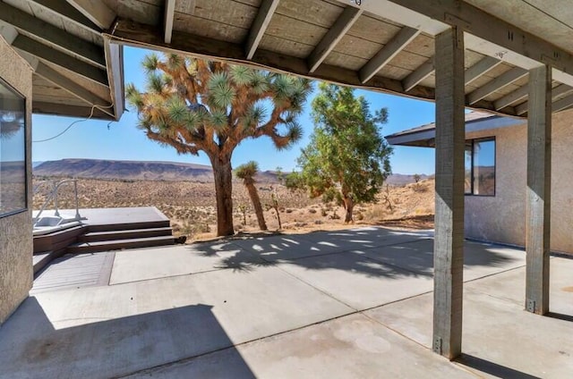 view of patio with a mountain view