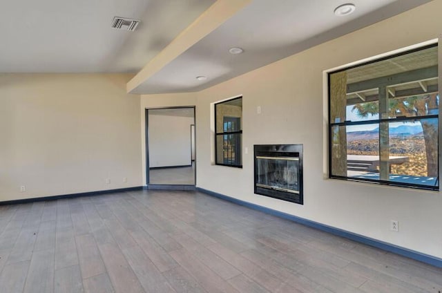 spare room featuring light hardwood / wood-style floors