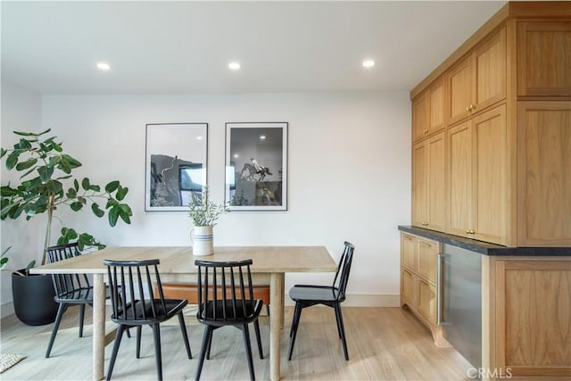 dining room with breakfast area and light hardwood / wood-style flooring