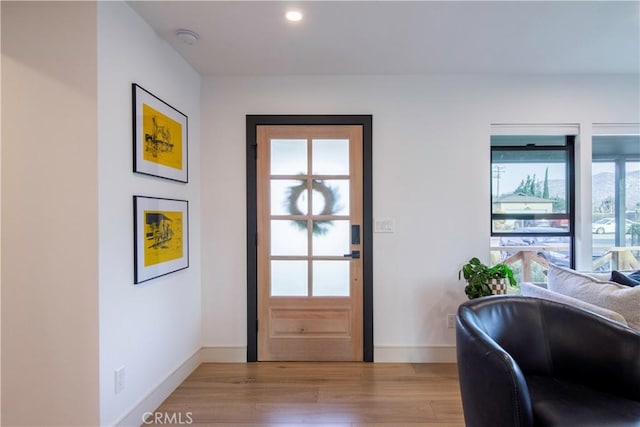 doorway to outside featuring light hardwood / wood-style flooring