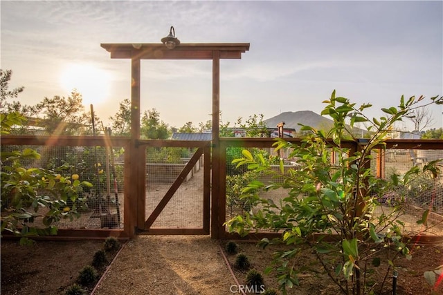 view of gate at dusk