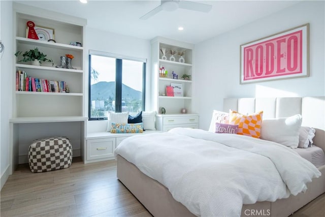 bedroom featuring ceiling fan and light hardwood / wood-style floors