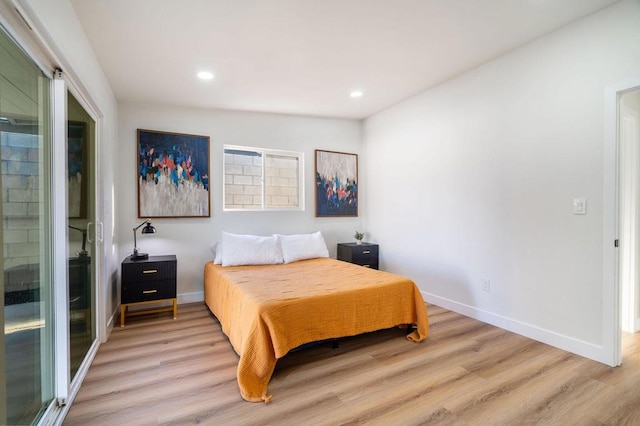 bedroom with light hardwood / wood-style floors