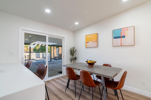 dining room with light hardwood / wood-style floors