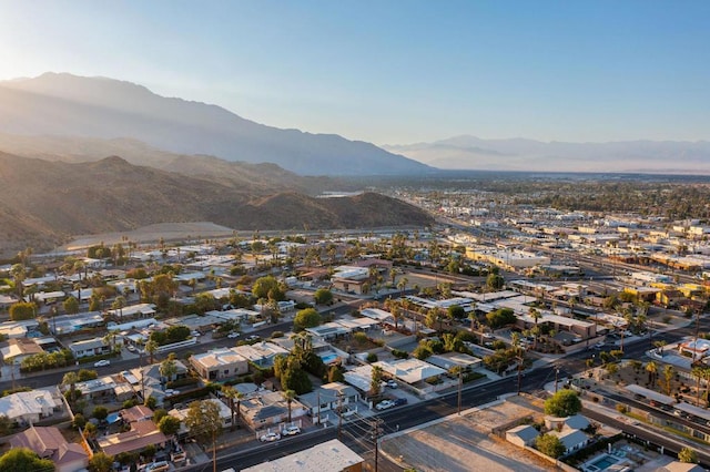 birds eye view of property with a mountain view