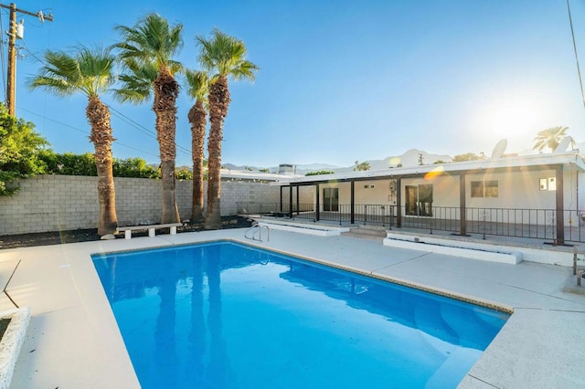 view of swimming pool with a patio area