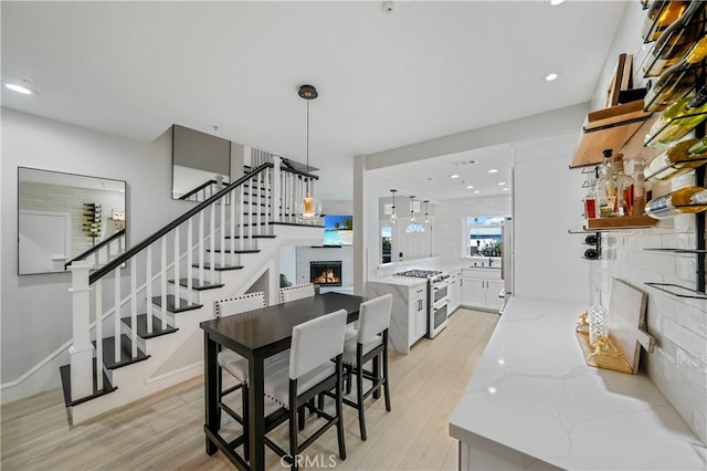 dining area with light hardwood / wood-style floors