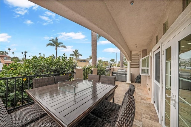 view of patio with a grill