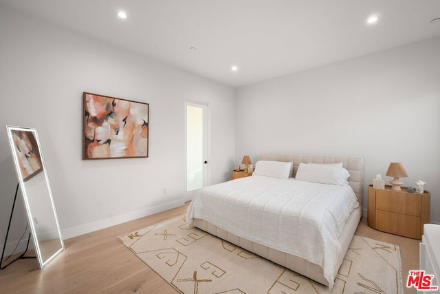 bedroom featuring light wood-type flooring