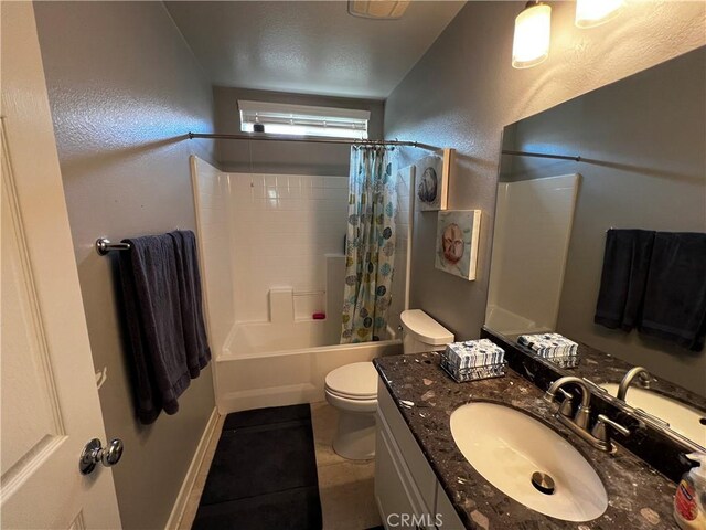 bathroom with a textured wall, toilet, tile patterned floors, shower / bathtub combination with curtain, and vanity