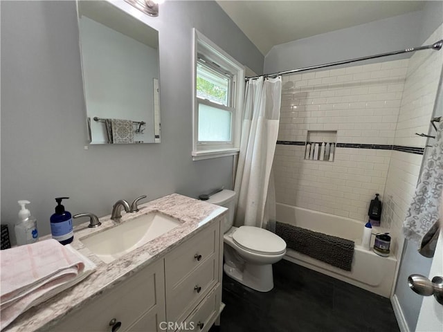 full bathroom featuring vanity, shower / bath combo, and toilet