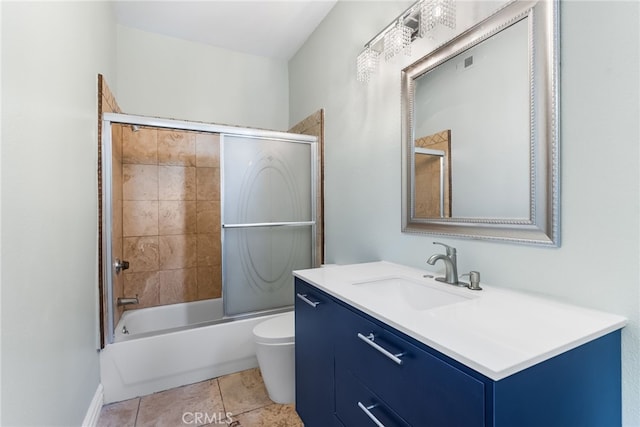 full bathroom featuring tile patterned flooring, vanity, shower / bath combination with glass door, and toilet