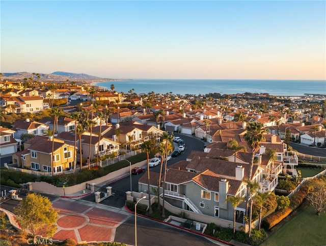 aerial view at dusk with a water view